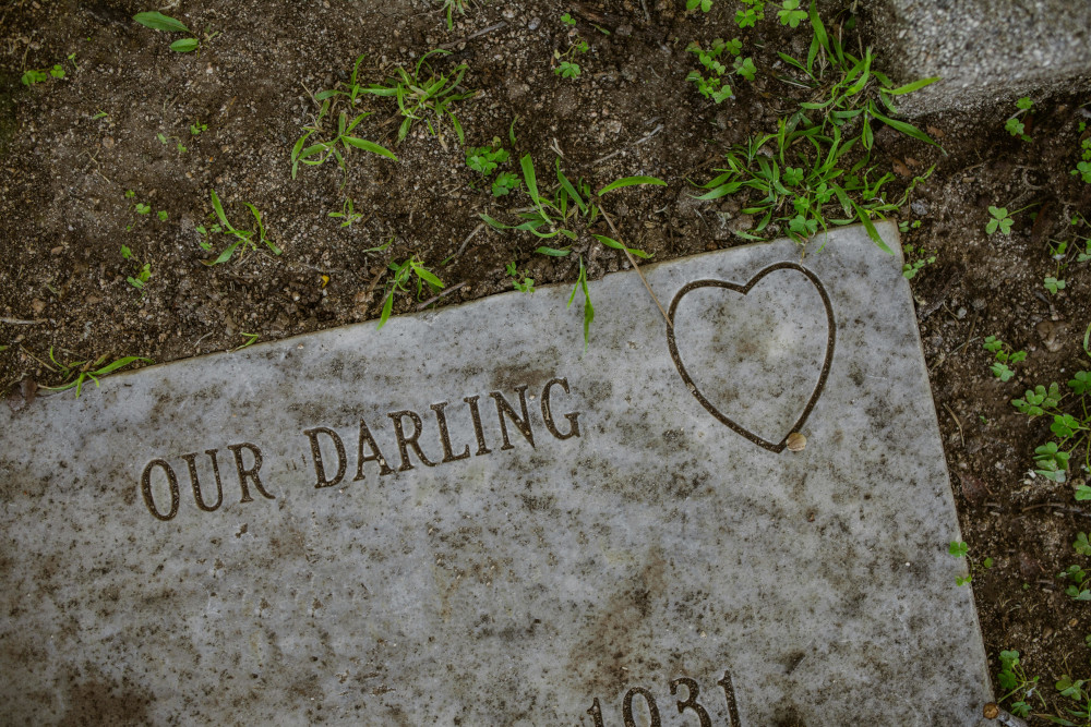 Flat grave marker with engraved inscription